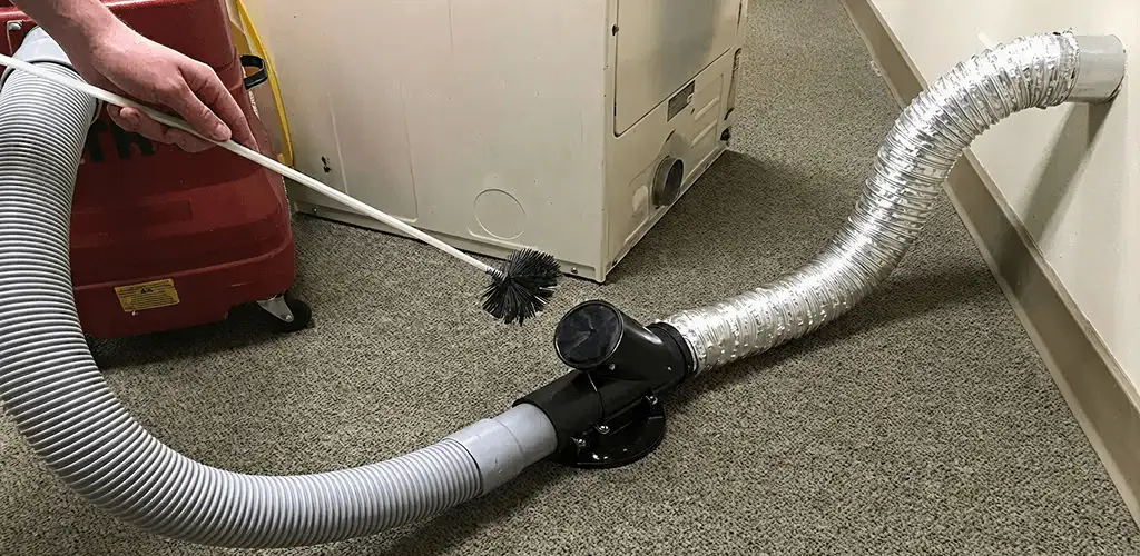Dryer vent cleaning service removing lint from a dryer duct connection in Cincinnati, OH