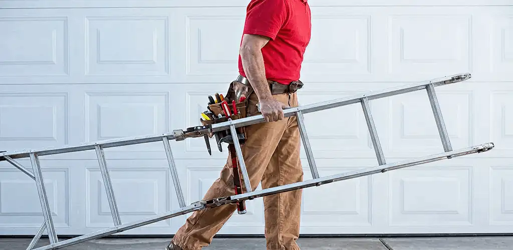 Garage door repair technician arriving with tools and ladder in Cincinnati, OH