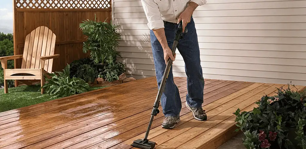 Deck staining service applying stain to a backyard wood deck in Cincinnati, OH